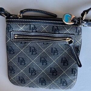 Dooney & Bourke Signature Crossbody Bag. Adjustable leather strap